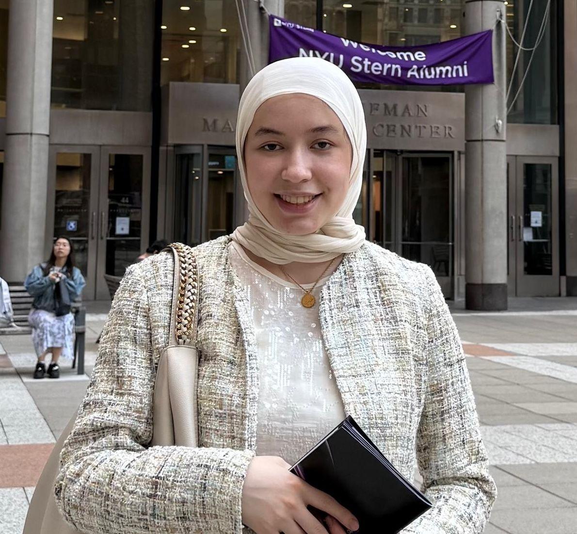 Zuhra Maksudi standing outside NYU Stern