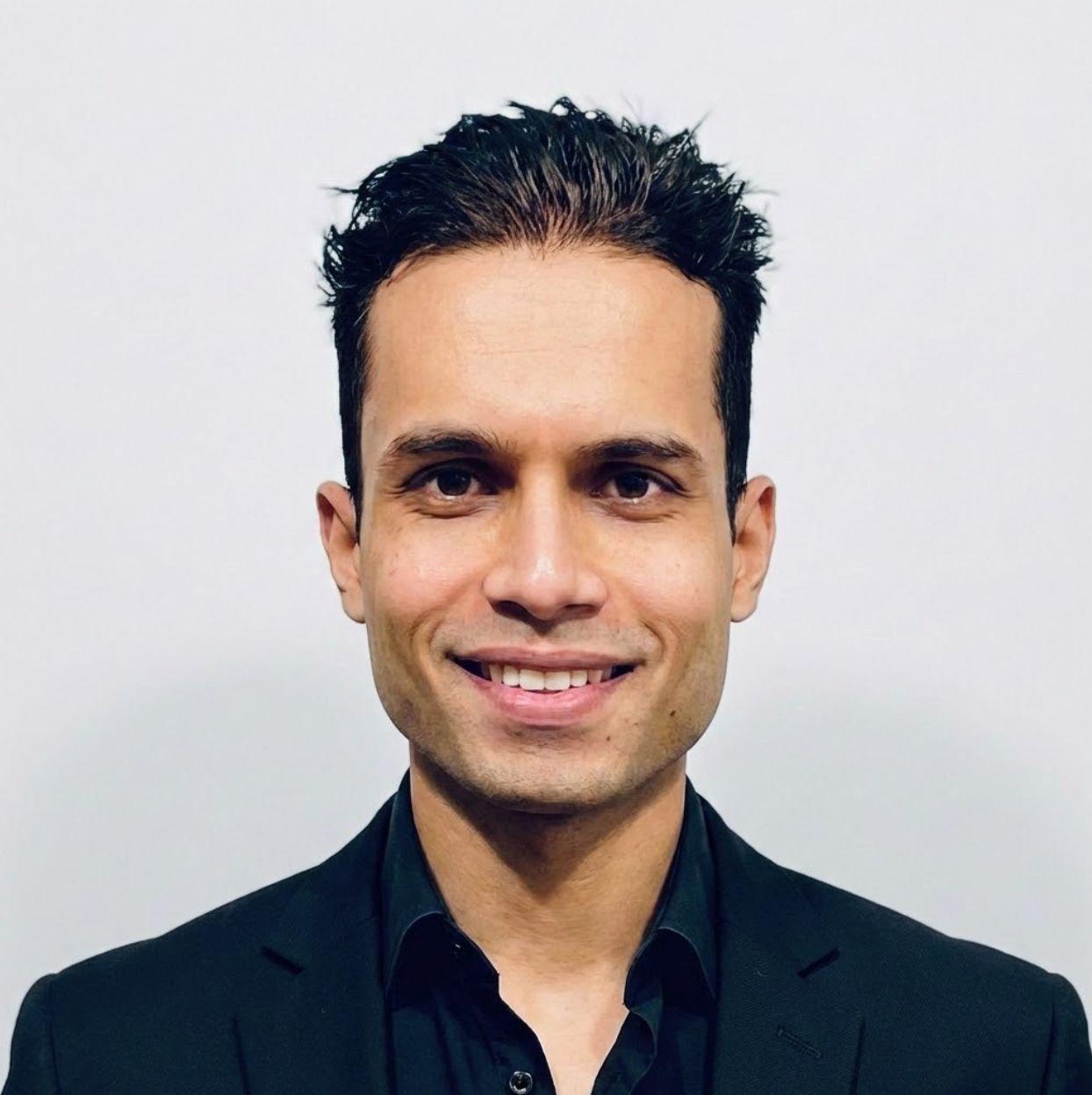 Sagar Vinod Gour in a black shirt and jacket